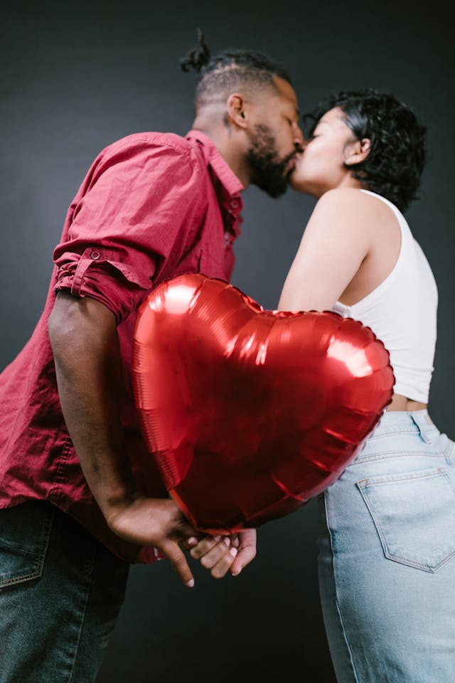 man and woman kissing